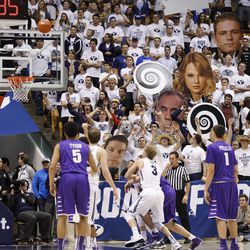 Students heckle during a foul shot as Brigham Young University defeats Portland 97-88 in NCAA men's basketball Monday, Dec. 29, 2014, in Provo.  
