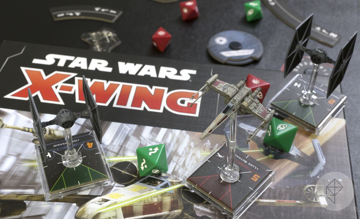 Star Wars: X-Wing Second Edition board and miniatures photo, including a X-wing and two TIE Fighters along with custom dice, markers, and more.