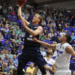 BYU's Tyler Haws (3) shoots against Portland's Bryce Pressley (1) during the first half of an NCAA college basketball game in Portland, Ore., Thursday Feb. 26, 2015.