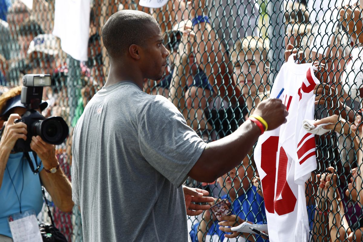 Jul 27, 2012; Albany, NY, USA; New York Giants wide receiver Victor Cruz signs autographs after training camp at University Field at SUNY Albany.  Mark L. Baer-US PRESSWIRE