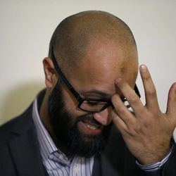 CAGE research director, Asim Qureshi gestures during a press conference held by the CAGE human rights charity in London, Thursday, Feb. 26, 2015. A British-accented militant who has appeared in beheading videos released by the Islamic State group in Syria bears “striking similarities” to a man who grew up in London, a Muslim lobbying group said Thursday. Mohammed Emwazi has been identified by news organizations as the masked militant more commonly known as “Jihadi John.” London-based CAGE, which works with Muslims in conflict with British intelligence services, said Thursday its research director, Asim Qureshi, saw strong similarities, but because of the hood worn by the militant, “there was no way he could be 100 percent certain.” 