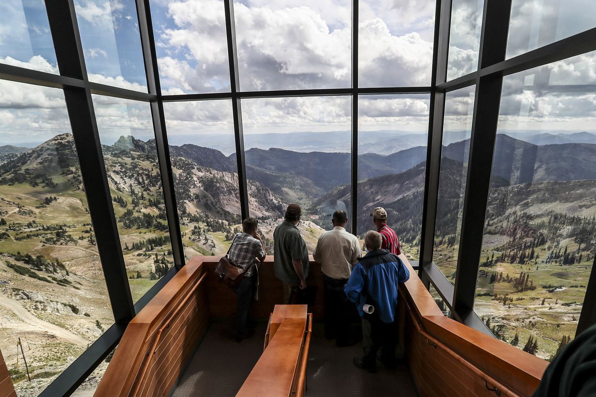 People take in the view from the restaurant at the top of Snowbird as members of two legislative bodies tour areas of Snowbird and Solitude to learn more about the proposed federal designation by Wasatch Canyons Commission on Monday, Sept. 16, 2019.