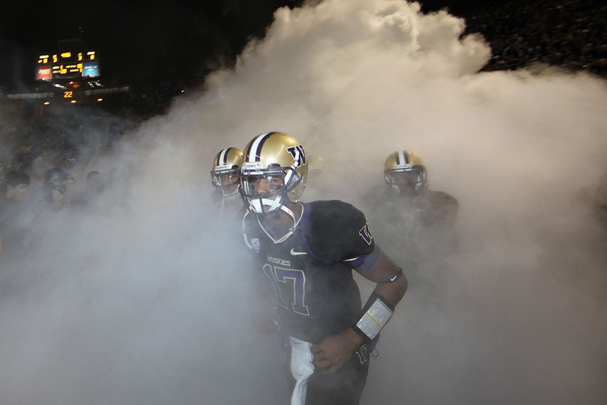 Keith Price and the Husky offense played like they were in a fog most of the evening against Oregon. The Ducks defeated the Huskies 34-17. (Photo by Otto Greule Jr/Getty Images)