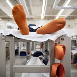 Detainees lie on their bunks in their pod at the Stewart Detention Center, in Lumpkin, Ga, on Friday, Nov. 15, 2019.. The rural town is about 140 miles southwest of Atlanta and right next to the Georgia-Alabama state line. The town’s 1,172 residents are outnumbered by the roughly 1,650 male detainees that U.S. Immigration and Customs Enforcement said were being held in the detention center in late November. 