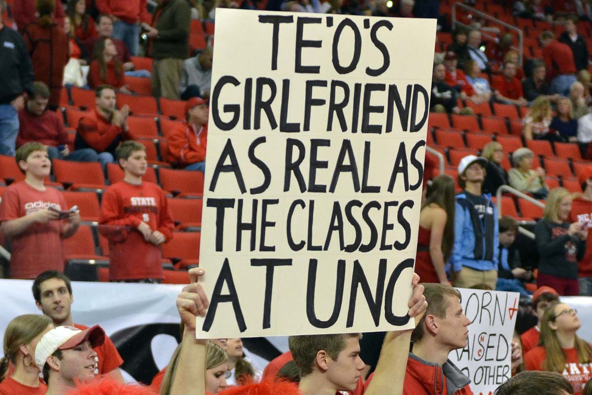 Raleigh, NC, USA; North Carolina State Wolfpack fan holds up a sign prior to a game against the North Carolina Tar Heels at PNC Arena.