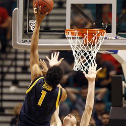 Cal Bears forward Ivan Rabb (1) reaches over Utah Utes forward Jakob Poeltl (42) during the Pac-12 conference tournament semifinal at the MGM Grand Garden Arena in Las Vegas, Friday, March 11, 2016.