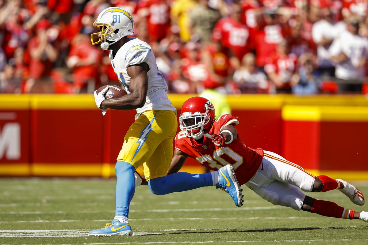 Mike Williams #81 of the Los Angeles Chargers runs past Deandre Baker #30 of the Kansas City Chiefs during the fourth quarter at Arrowhead Stadium on September 26, 2021 in Kansas City, Missouri.
