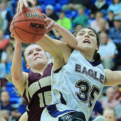 Maple Mountain's Elisabeth Eastmond and Skyline's Sara Weixler battle for the ball during play Friday, Feb. 20, 2015, in 4A semifinal action at Salt Lake Community College in Taylorsville.