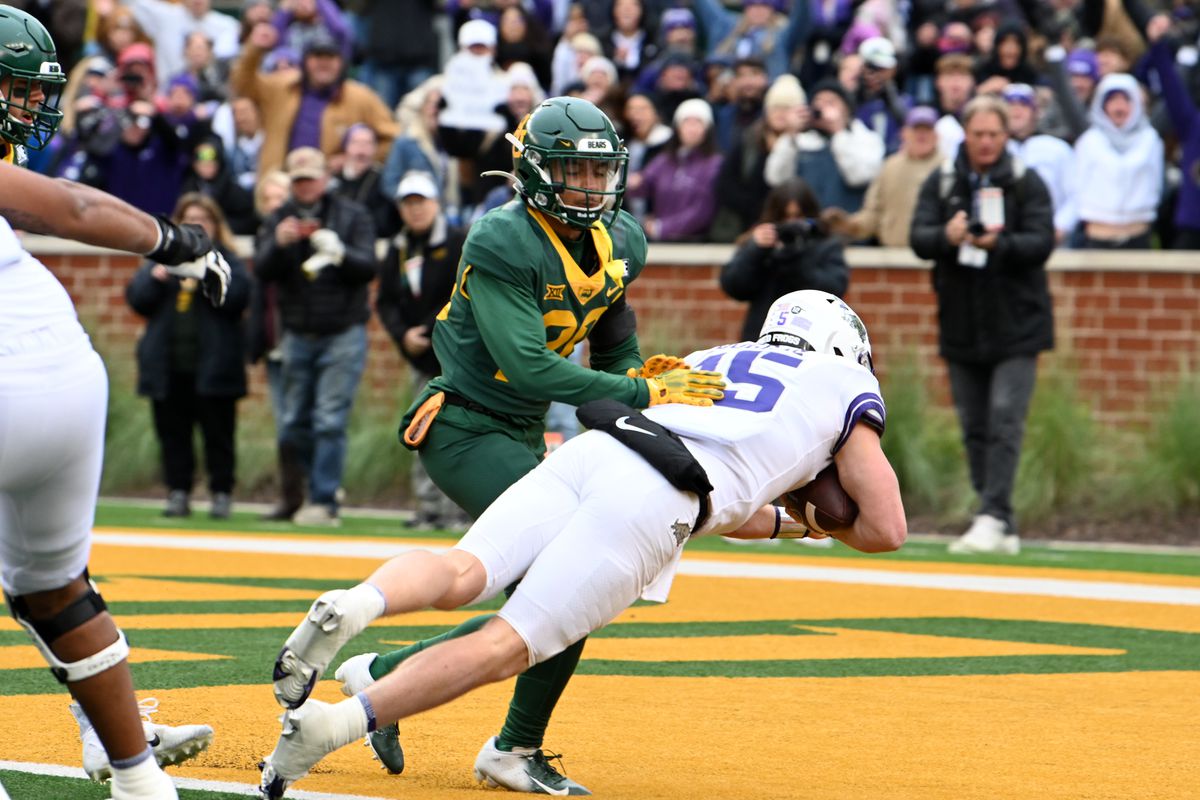 TCU Horned Frogs QB Max Duggan dives into the end zone as Baylor Bears DB Devin Lemear arrives too late during the college football game between the TCU Horned Frogs and the Baylor Bears on November 19, 2022 at McLane Stadium in Waco, TX.