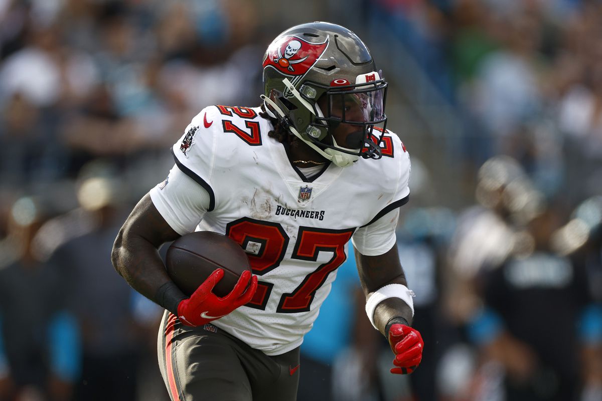 Ronald Jones #27 of the Tampa Bay Buccaneers carries the ball during the first half of the game against the Carolina Panthers at Bank of America Stadium on December 26, 2021 in Charlotte, North Carolina.