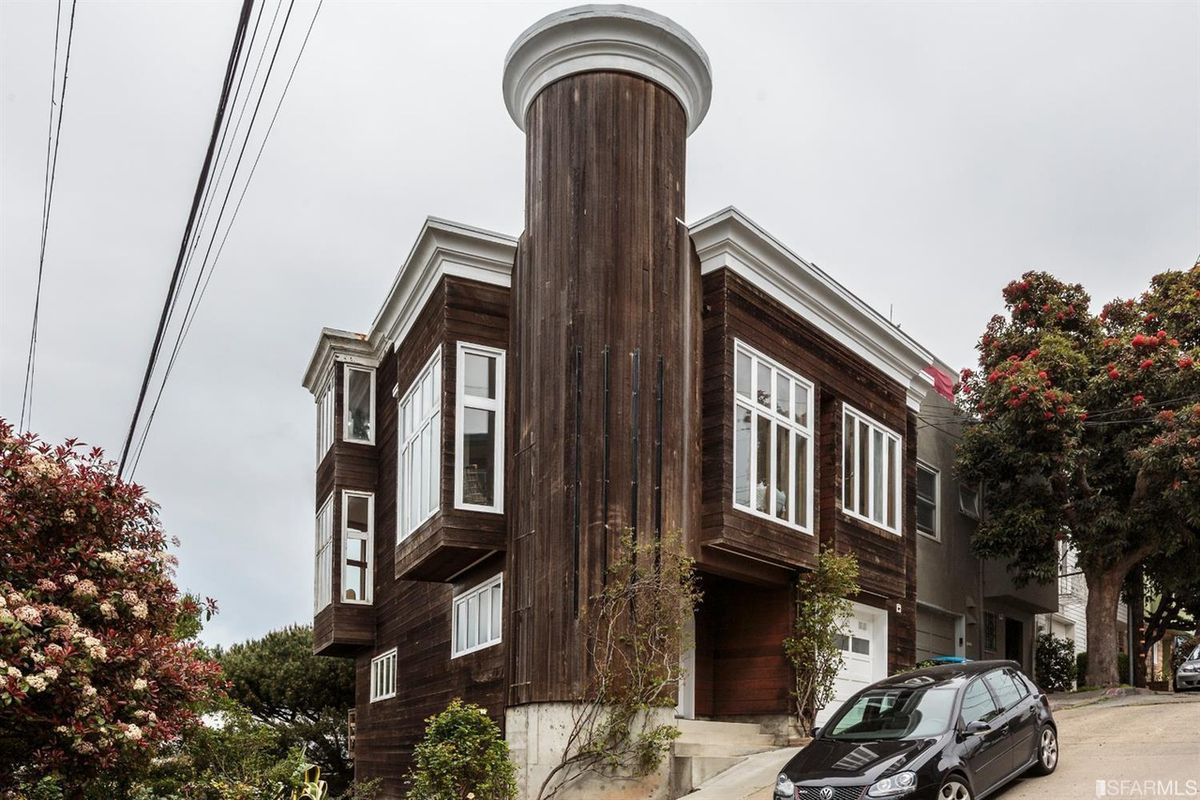 Wood-paneled home in Bernal with massive turret.