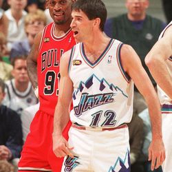 John Stockton complains to the ref as Dennis Rodman smiles during Game 6 of the NBA Finals at the Delta Center, June 14, 1998.
