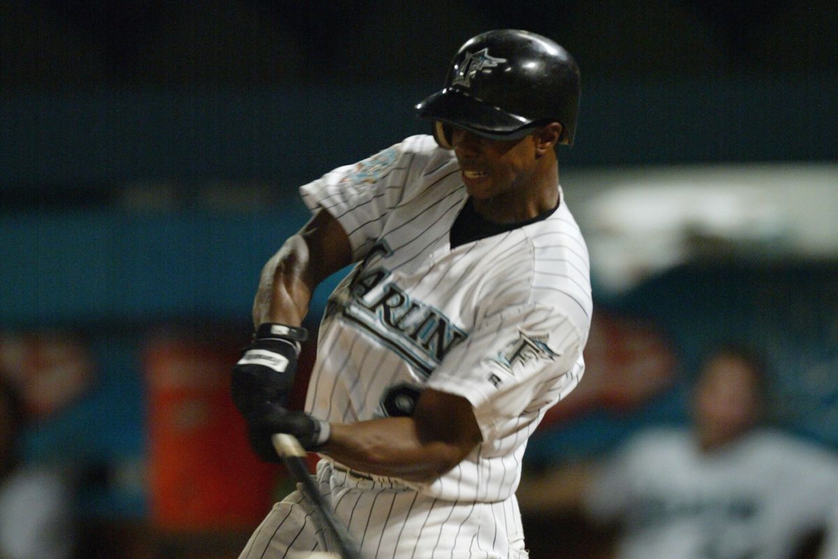 Center fielder Juan Pierre #9 of the Florida Marlins swings at an Atlanta Braves pitch during the MLB game at Pro Player Stadium on July 2, 2003 in Miami, Florida.
