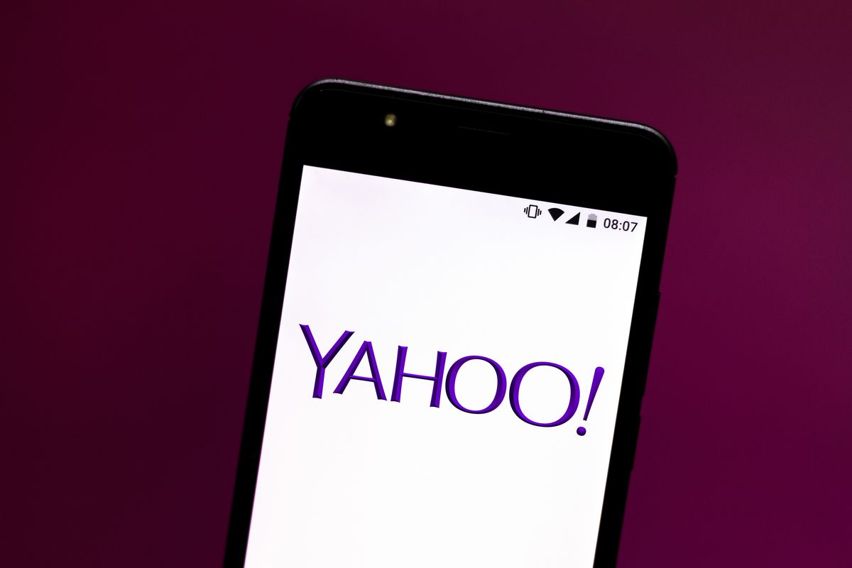 In this photo illustration the Yahoo! logo is seen displayed...