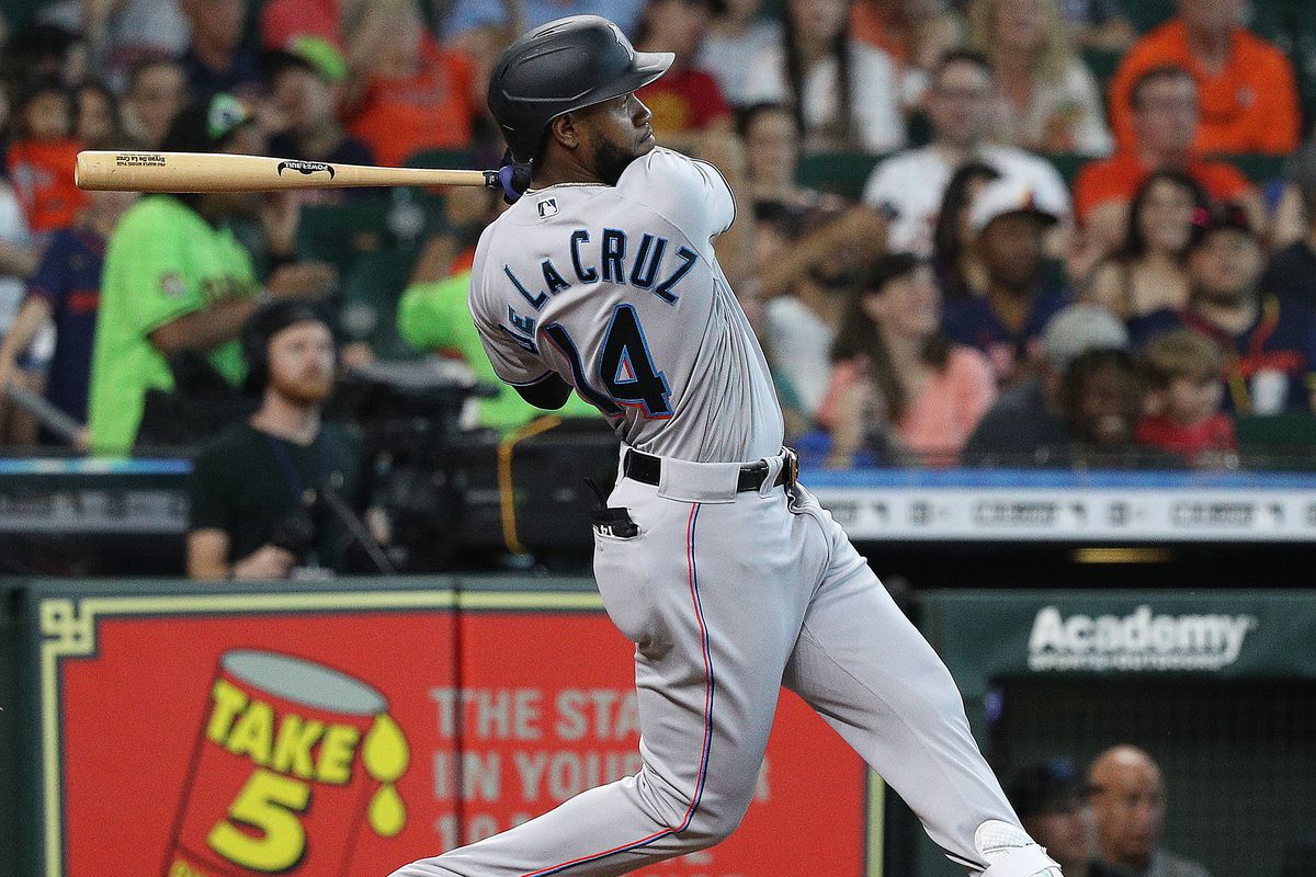 Bryan De La Cruz #14 of the Miami Marlins hits a three run home run in the seventh inning against the Houston Astros at Minute Maid Park on June 12, 2022 in Houston, Texas.