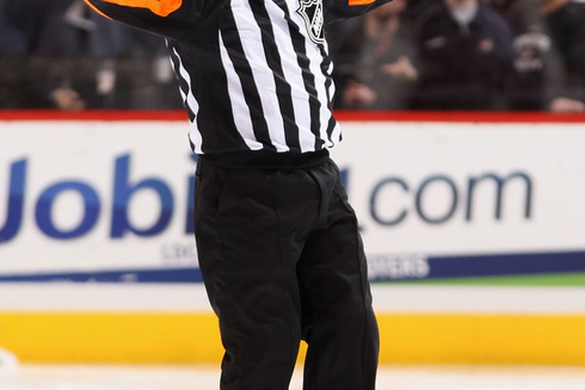Referee Dan O'Halloran being awful at his job - Coyotes are due some lovin' tonight from the zebras after the Ducks fiasco.  (Photo by Christian Petersen/Getty Images)