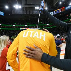 Utah Jazz guard Donovan Mitchell (45) sprays water on guard Ricky Rubio (3) after the Jazz won 129-99 over the Golden State Warriors at Vivint Arena in Salt Lake City on Tuesday, Jan. 30, 2018.