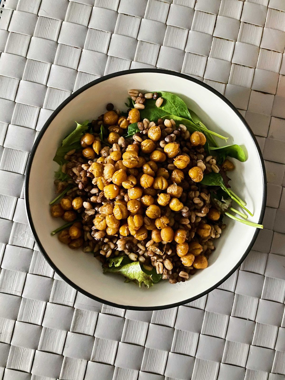 a salad topped with chickpeas.