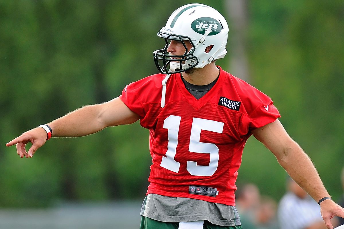 July 27, 2012; Cortland, NY, USA; New York Jets quarterback Tim Tebow (15) calls a play at the line during training camp at SUNY Cortland. Mandatory Credit: Rich Barnes-US PRESSWIRE