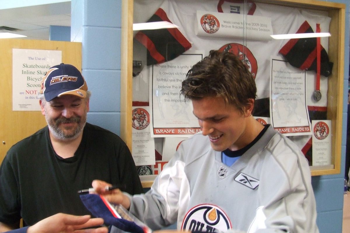 Edmonton Oilers prospect Anton Lander signing and smiling for his adoring public at the Oilers prospect camp in Edmonton July 2010