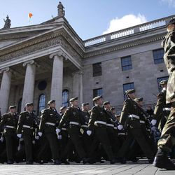 Thousands of soldiers march through the streets of Dublin, Ireland, Sunday, March 27, 2016.  Thousands of soldiers marched solemnly Sunday through the crowded streets of Dublin to commemorate the 100th anniversary of Ireland's Easter Rising against Britain, a fateful rebellion that reduced parts of the capital to ruins and inspired the country's eventual independence. 