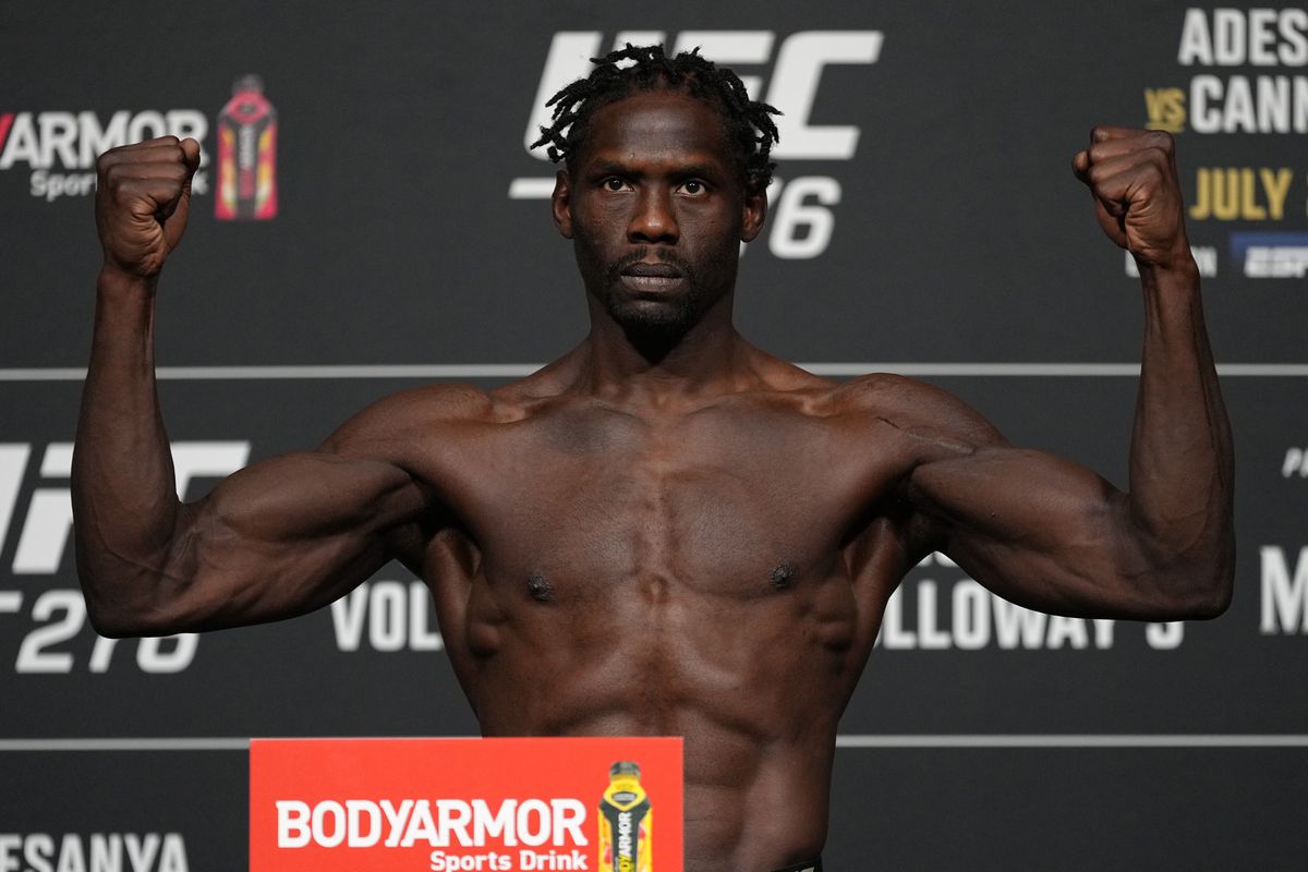 Jared Cannonier poses on the scale during the UFC 276 official weigh-in at UFC APEX on July 01, 2022 in Las Vegas, Nevada.