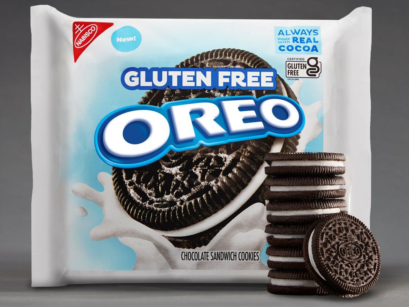 A white package of gluten-free Oreos against a gray background, with a stack of Oreo cookies in front of it.