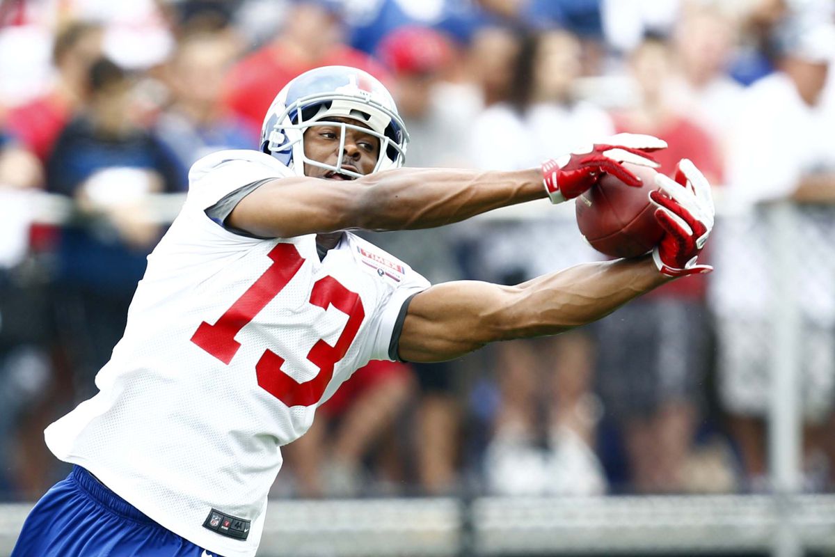 Jul 28, 2012; Albany, NY, USA; New York Giants wide receiver Ramses Barden (13) dives for a ball during training camp at University Field at SUNY Albany. Mark L. Baer-US PRESSWIRE