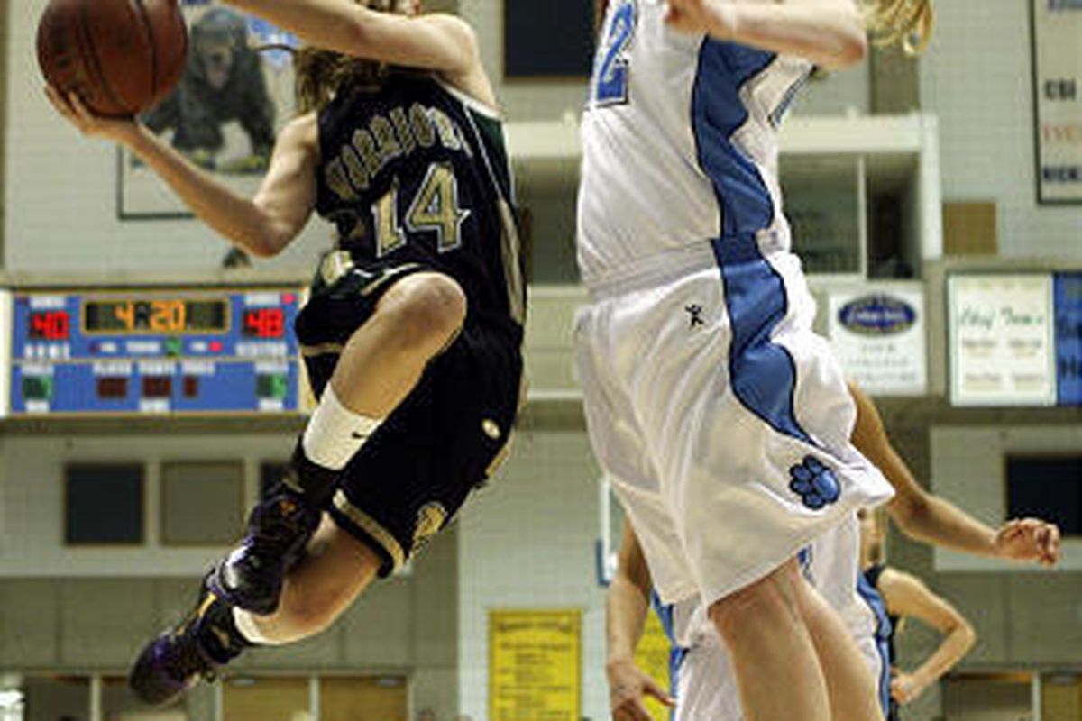 Amy Harris, left, of Snow Canyon, is fouled by Aubry Boehme of Sky View.