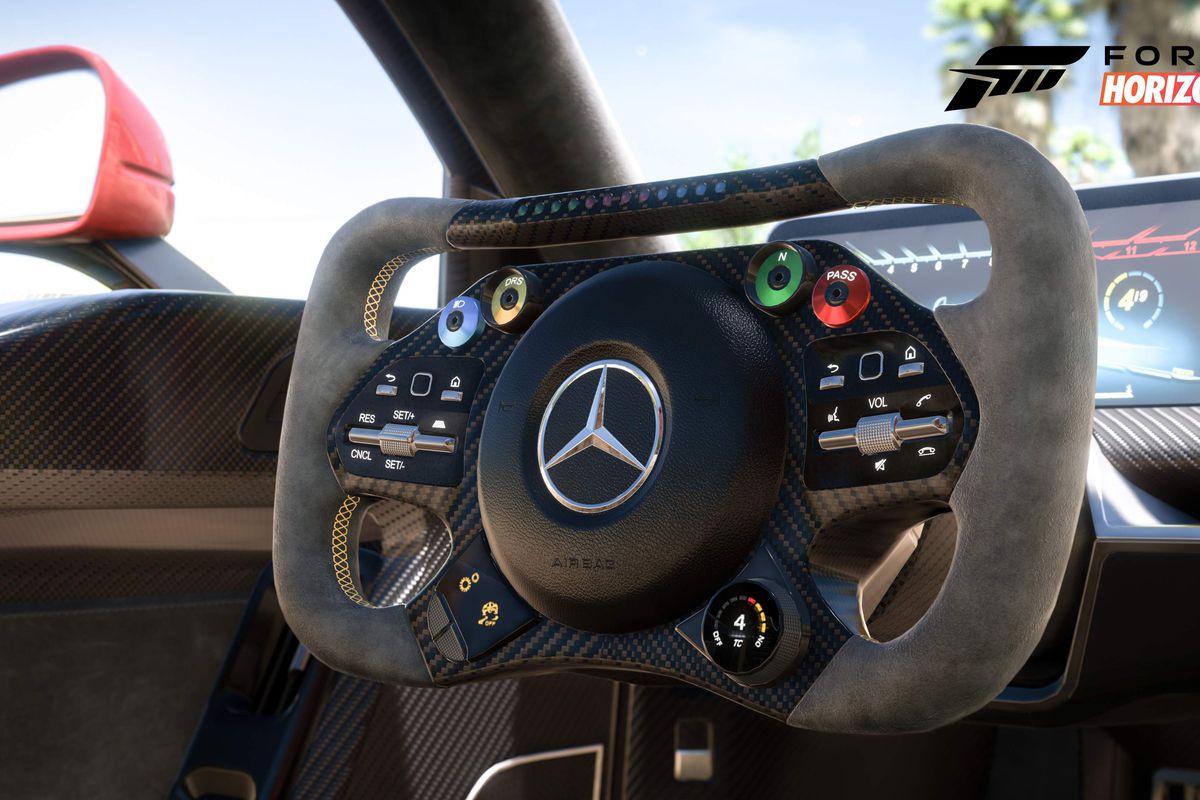 the futuristic interior of the Mercedes-AMG One, with a rectangular steering wheel and a tablet-shaped dashboard, in Forza Horizon 5