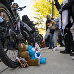 Stuffed animals are left at the tires of a Chicago police officers bikes, which are being used as a shield to prevent activists from getting closer to the Chicago Police Training Academy, Friday, April 30, 2021.