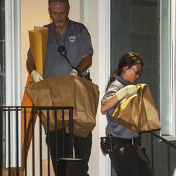 Investigators bring bags of evidence out of a home at 547 N. 1000 West in Salt Lake City as police serve a search warrant in connection to the disappearance of University of Utah student Mackenzie Lueck on Wednesday, June 26, 2019.