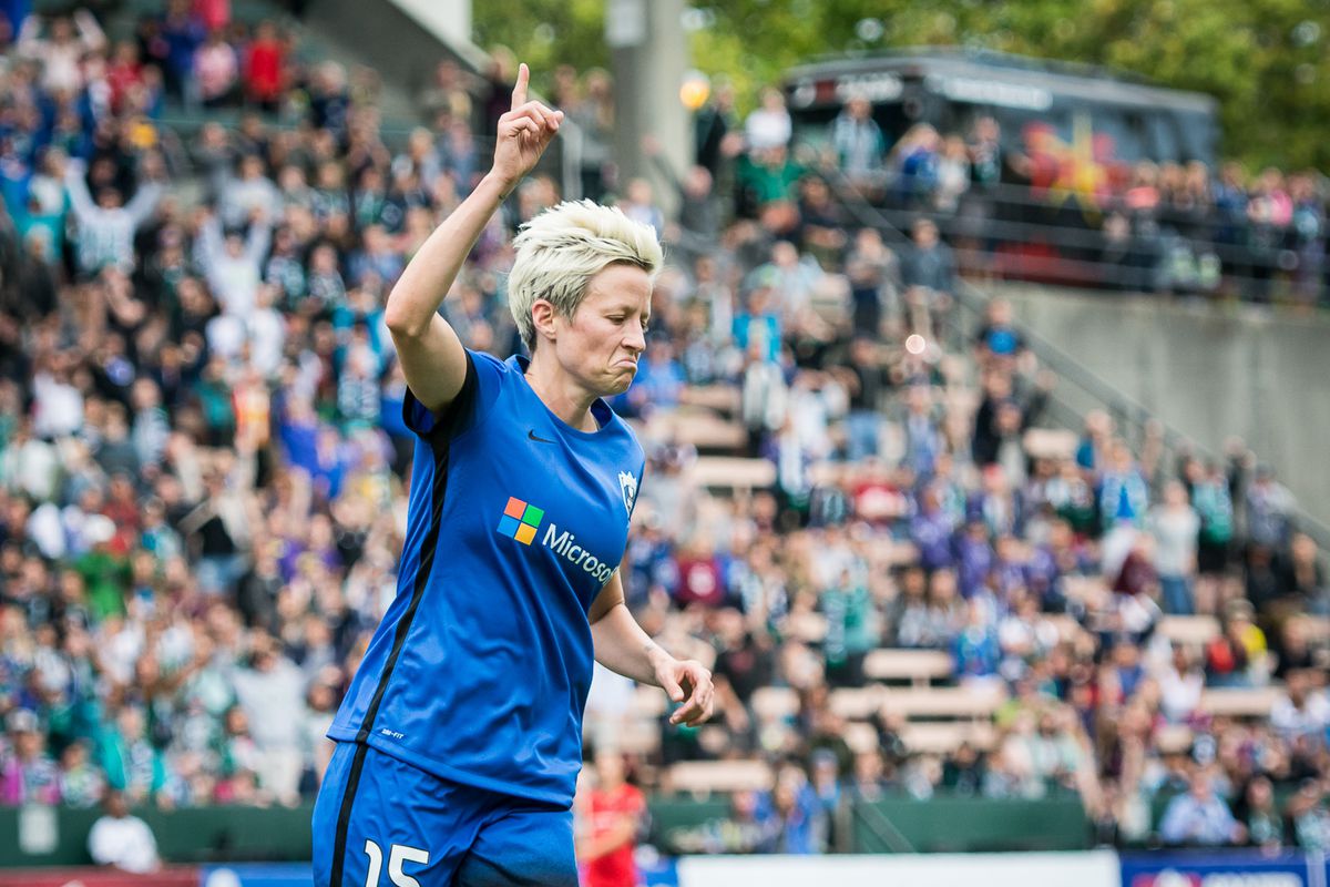 Megan Rapinoe celebrates her goal late in a match between the Reign and Thorns