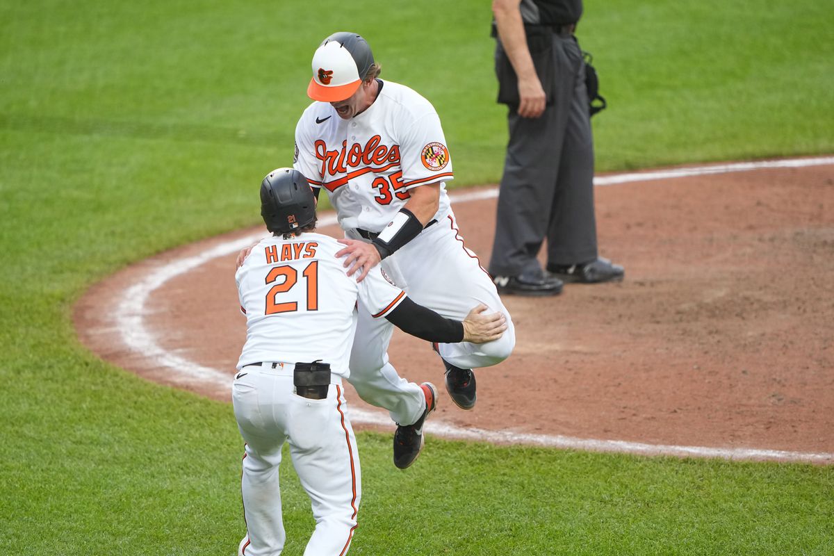 Two Baltimore Orioles celebrate a win over the Tampa Bay Rays