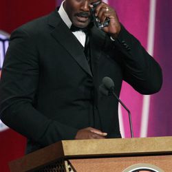 2010 Basketball Hall of Fame inductee Karl Malone wipes tears as he speaks during his enshrinement ceremony in Springfield, Mass. Friday, Aug. 13, 2010. Malone announced Wednesday he is returning to Utah in a part-time coaching capacity.