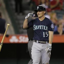 Seattle Mariners' Kyle Seager tosses his bat after striking out during the seventh inning of a baseball game against the Los Angeles Angels in Anaheim, Calif., Tuesday, June 18, 2013. 