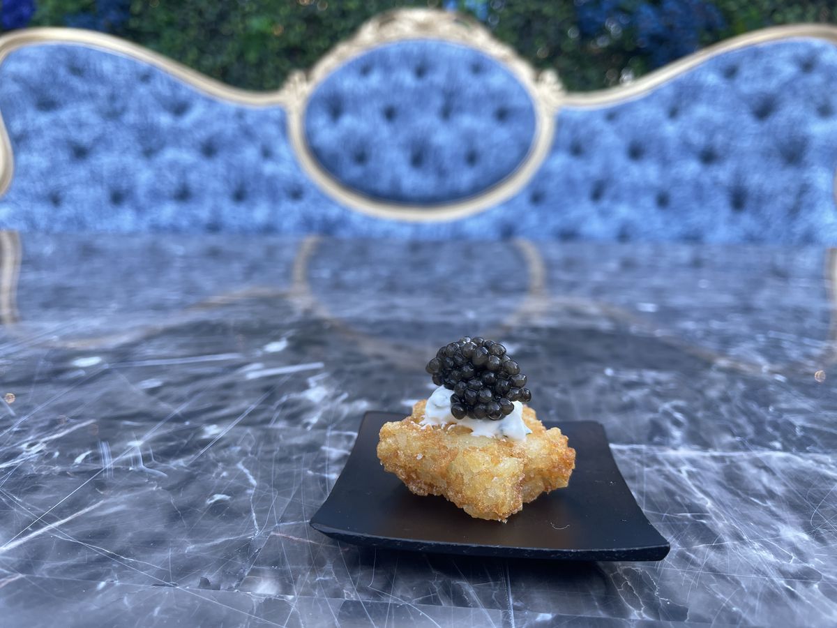 A star-shaped tater tot with caviar.
