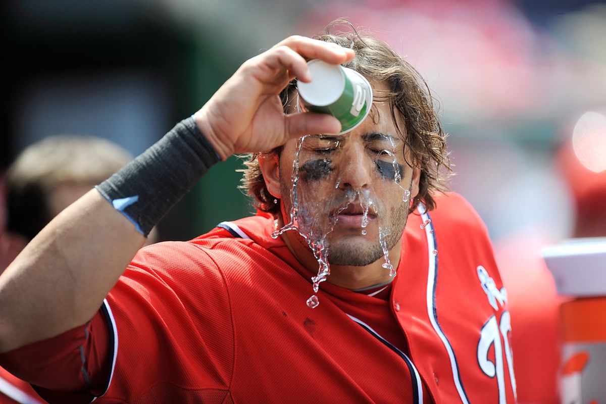WASHINGTON, DC - JUNE 17:  Michael Morse #38 of the Washington Nationals pours water over his head during the game against the New York Yankees at Nationals Park on June 17, 2012 in Washington, DC.  (Photo by Greg Fiume/Getty Images)