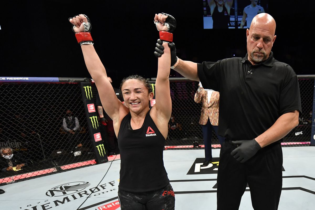 Carla Esparza celebrates after her split-decision victory over Michelle Waterson in their strawweight fight during the UFC 249 event at VyStar Veterans Memorial Arena on May 09, 2020 in Jacksonville, Florida.