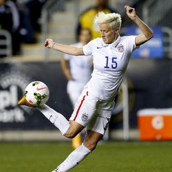 FILE - In this Oct. 24, 2014, file photo, United States midfielder Megan Rapinoe (15) against Mexico in the second half during a CONCACAF semifinal soccer match in Chester, Pa. Five players from the World Cup-winning U.S. national team have accused the U.S. Soccer Federation of wage discrimination in an action filed with the Equal Employment Opportunity Commission. Alex Morgan, Carli Lloyd, Megan Rapinoe, Becky Sauerbrunn and Hope Solo maintain in the EEOC filing they were payed nearly four times less than their male counterparts on the U.S. men's national team. The filing was announced in a press release on Thursday, March 31, 2016. 