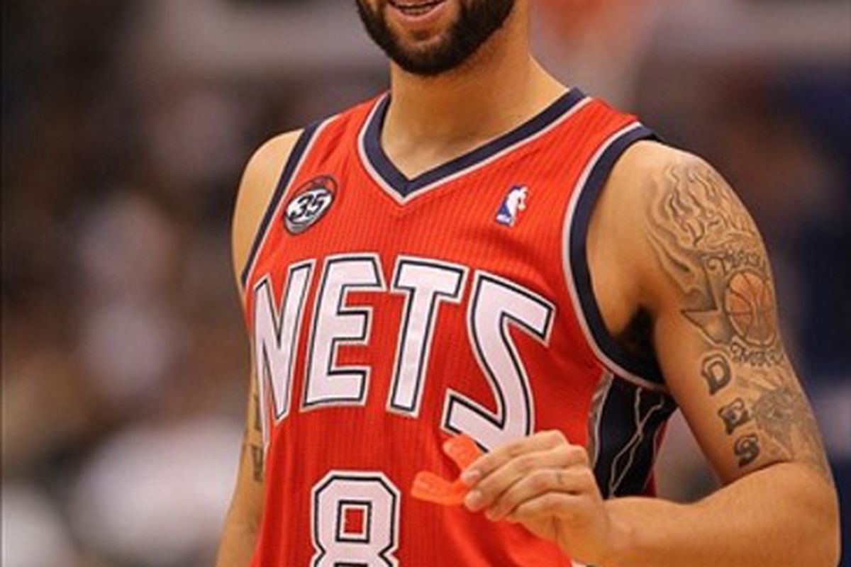 Feb 28, 2012; Dallas, TX, USA; New Jersey Nets guard Deron Williams (8) laughs during the second quarter against the Dallas Mavericks at American Airlines Center.  Mandatory Credit: Matthew Emmons-US PRESSWIRE