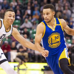 Golden State guard Stephen Curry (30) drives against Utah guard Dante Exum (11) during the second half of an NBA basketball game in Salt Lake City on Thursday, Dec. 8, 2016. Golden State defeated Utah with a final score of 106-99.