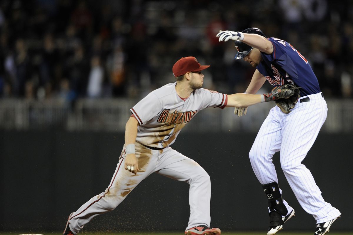 In this picture, the Twins' player is a metaphor for Diamondbacks fans this season