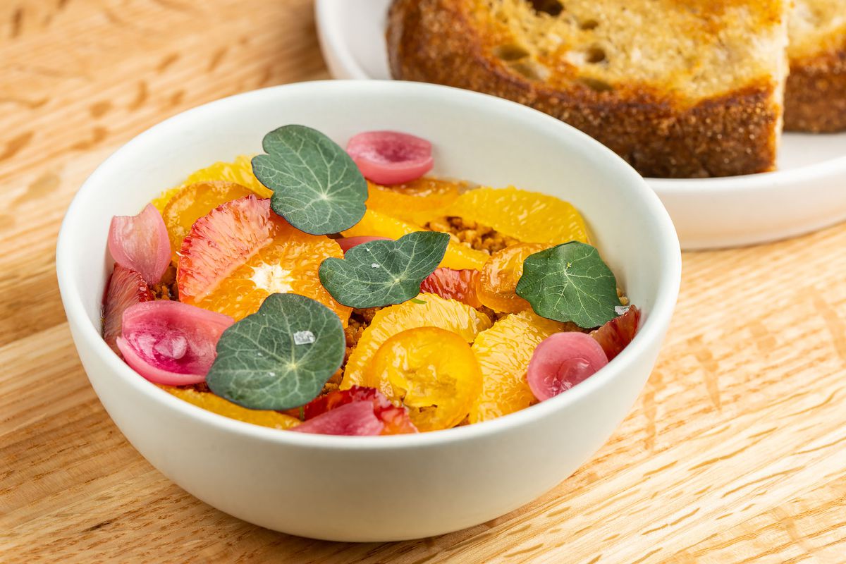 Chicken liver mousse with mandarin, pickled pearl onions, sourdough, and nasturtium at Asterid restaurant in Los Angeles