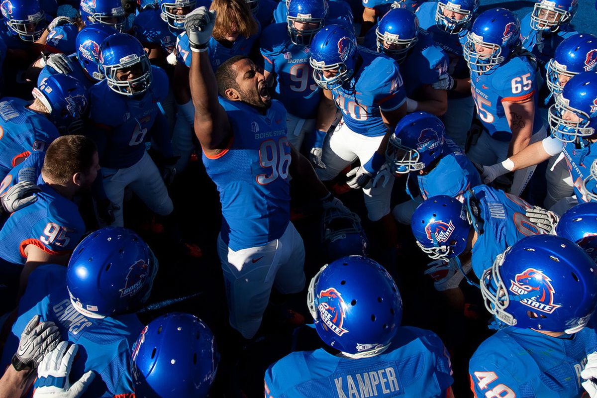 BOISE, ID - NOVEMBER 26: Jarrell Root #96 of the Boise State Broncos psyches up his team before the game against the Wyoming Cowboys at Bronco Stadium on November 26, 2011 in Boise, Idaho.  (Photo by Otto Kitsinger III/Getty Images)