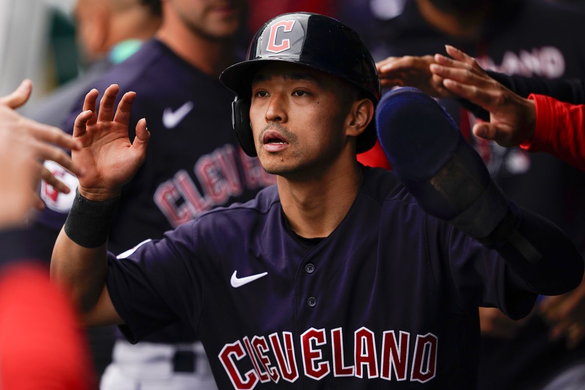 Steven Kwan #38 of the Cleveland Guardians celebrates scoring the second run of the game against the Kansas City Royals during the first inning at Kauffman Stadium on April 11, 2022 in Kansas City, Missouri.