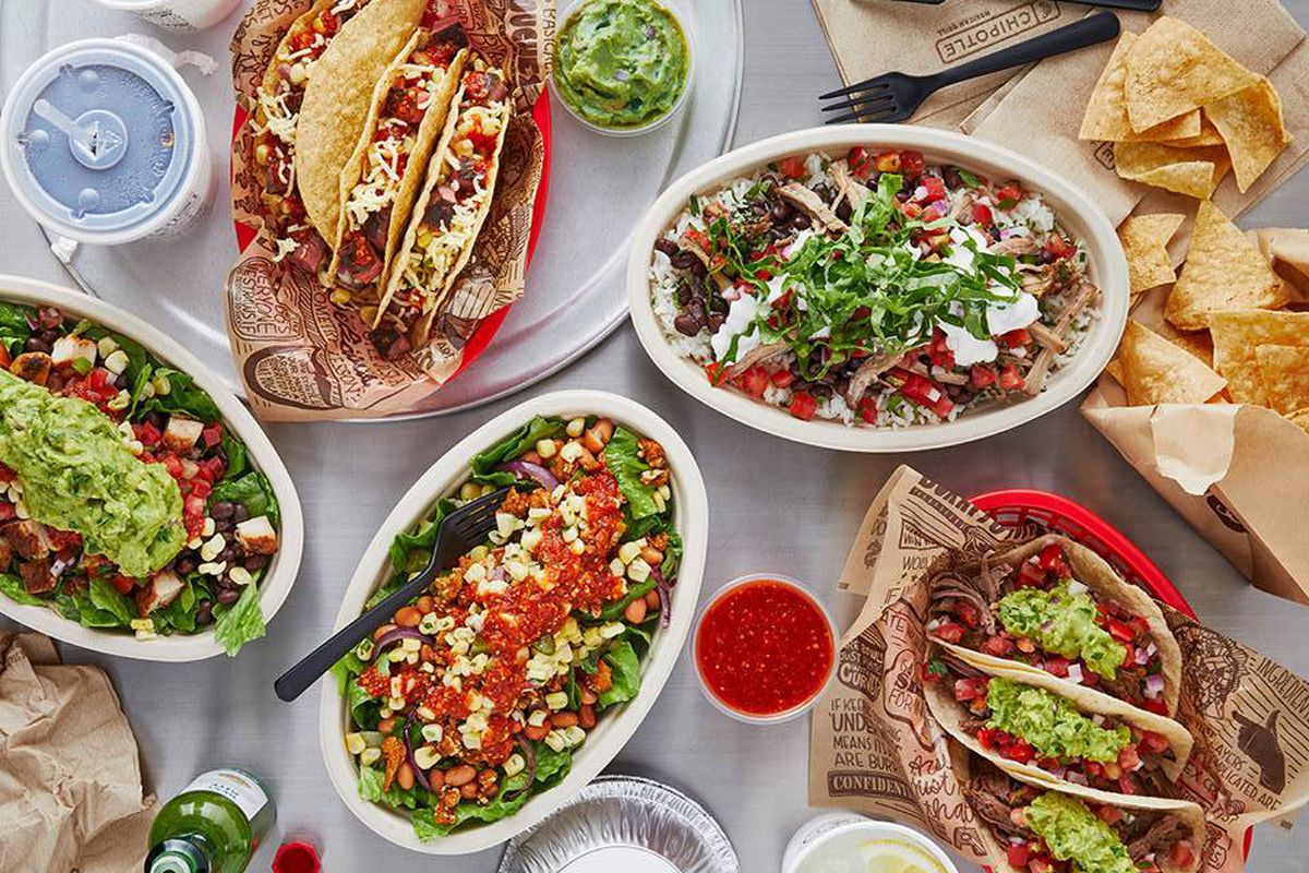 Spread of Chipotle food offerings on a table