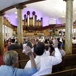 Attendees sustain leaders in the Tabernacle on  Temple Square during LDS Church Conference in Salt Lake City  Saturday, Oct. 1, 2011. 
