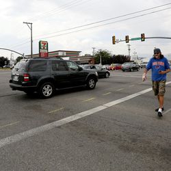 Rob Bradford crosses the intersection of 3500 South and Redwood Road in West Valley City, which with eight is one of the 10 intersections with the highest number of auto-pedestrian wrecks in Salt Lake County and Utah County, based on data from 2010-2016, on Tuesday, Aug. 8, 2017. Bradford says he's almost been hit half a dozen times in the last two weeks while crossing at this intersection.