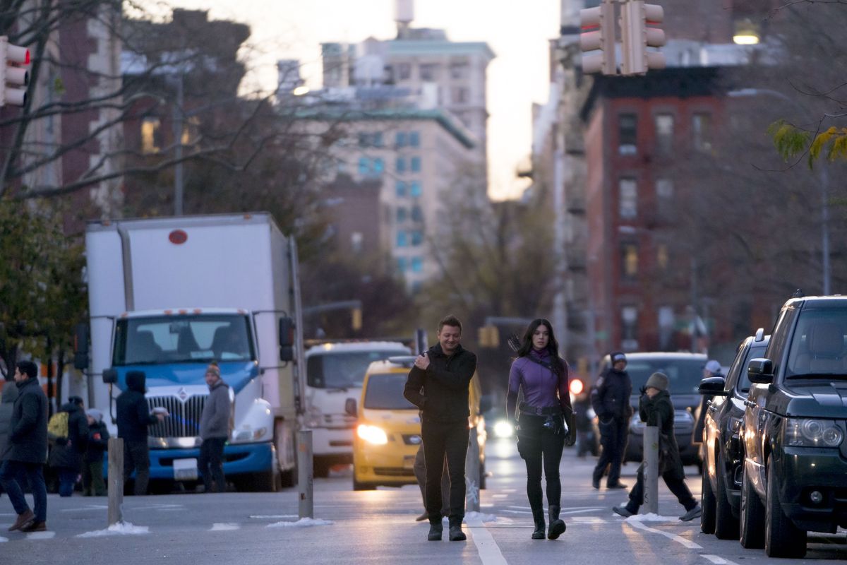 Clint Barton and Kate Bishop walk through New York City.